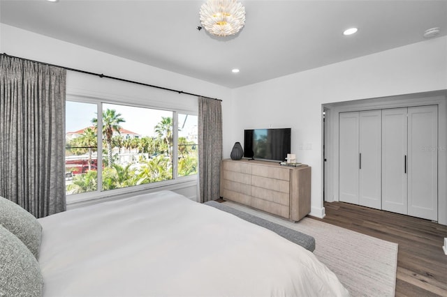 bedroom with dark wood-type flooring