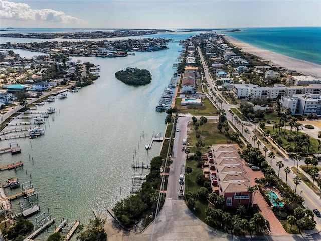 birds eye view of property featuring a water view and a view of the beach