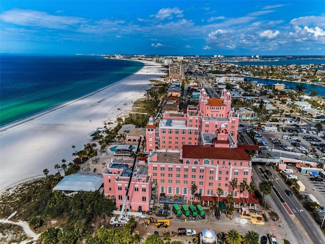 aerial view with a water view and a beach view