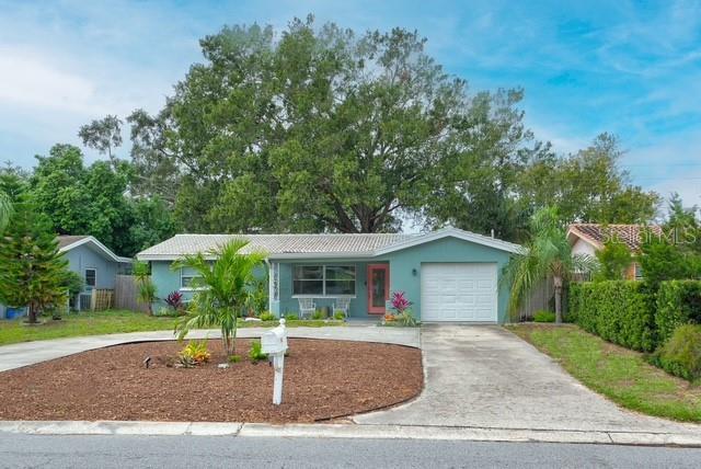 ranch-style home with a garage