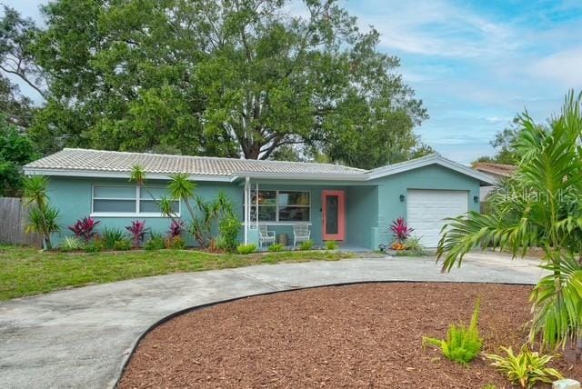 ranch-style house featuring a garage