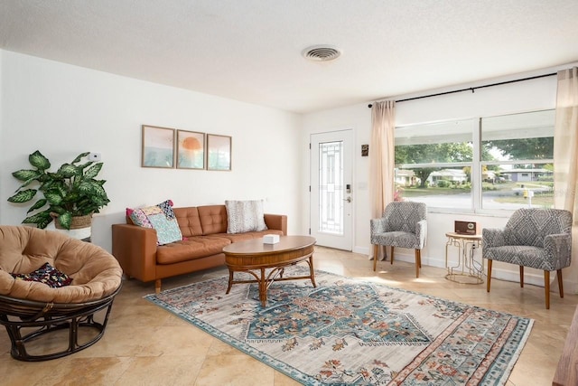 living room featuring a textured ceiling