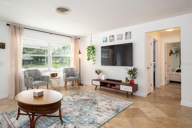 living room featuring a textured ceiling