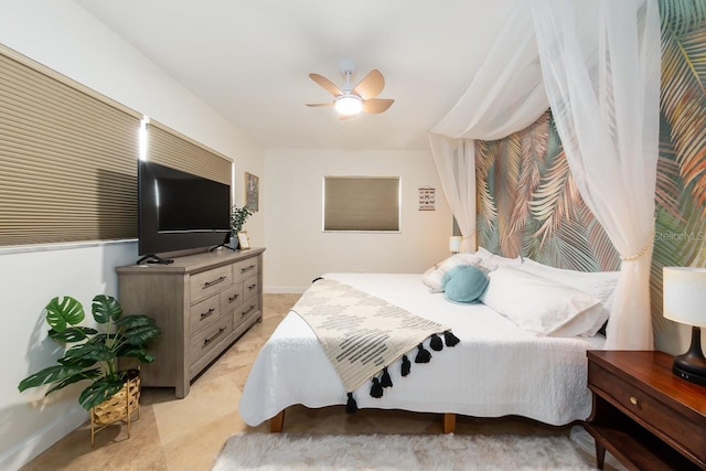 bedroom with ceiling fan and light tile patterned floors