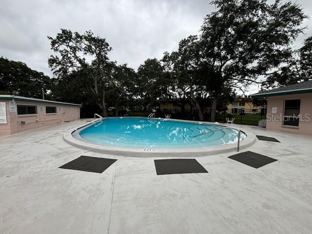 view of swimming pool featuring a patio