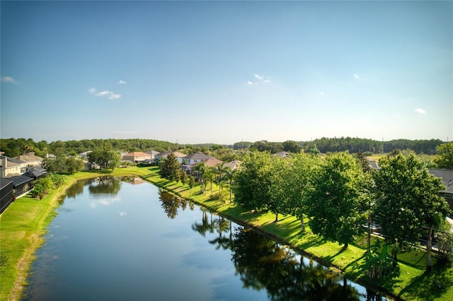 bird's eye view featuring a water view and a residential view