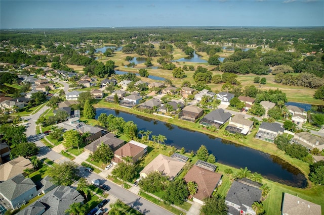 birds eye view of property featuring a water view and a residential view