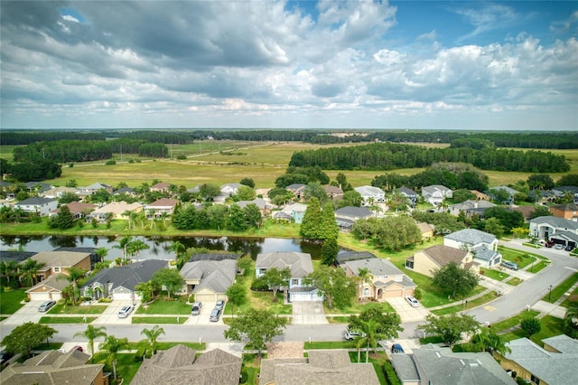 bird's eye view featuring a residential view and a water view