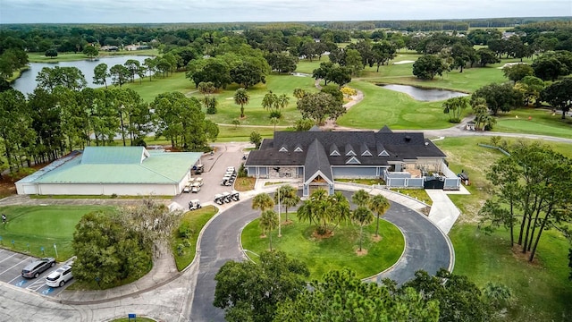 aerial view featuring a water view and golf course view
