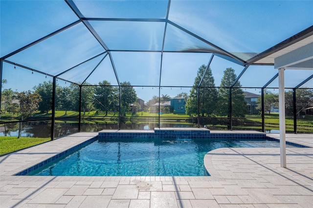 outdoor pool featuring a patio and glass enclosure