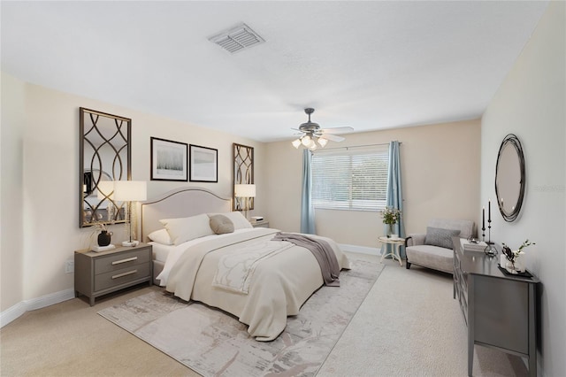 bedroom featuring a ceiling fan, baseboards, visible vents, and light carpet