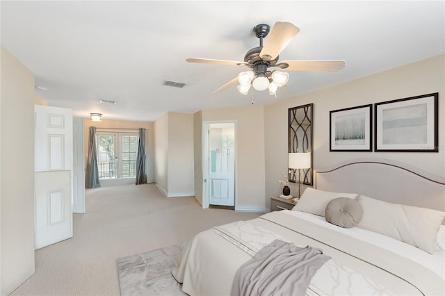 bedroom with visible vents, baseboards, ceiling fan, and light carpet