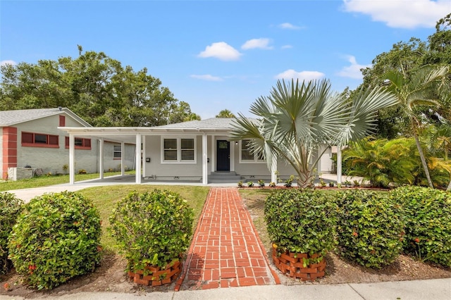 ranch-style home featuring a carport