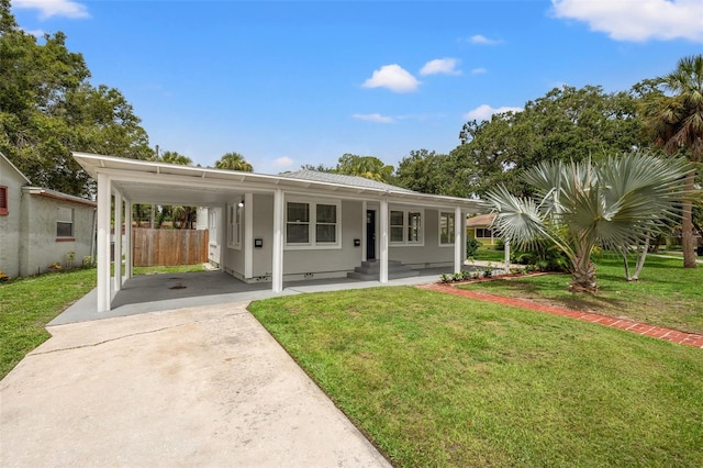 view of front of property featuring a carport and a front lawn