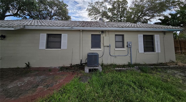 back of property with central AC unit