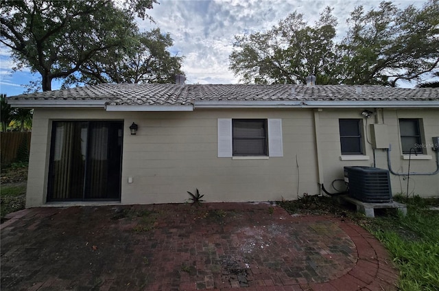 back of house with a patio and central AC unit