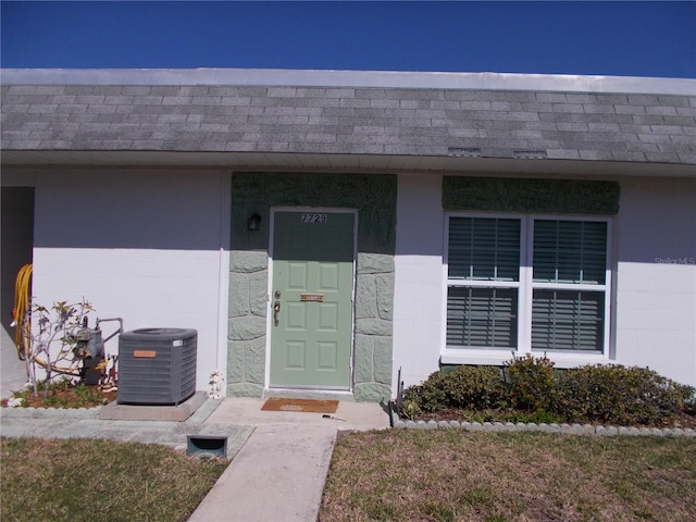 entrance to property featuring central AC unit