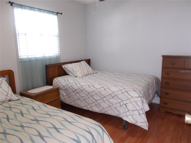 bedroom featuring hardwood / wood-style flooring