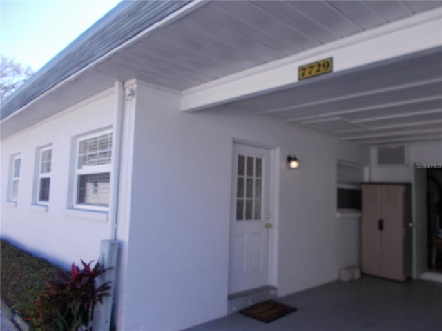 view of home's exterior with a carport