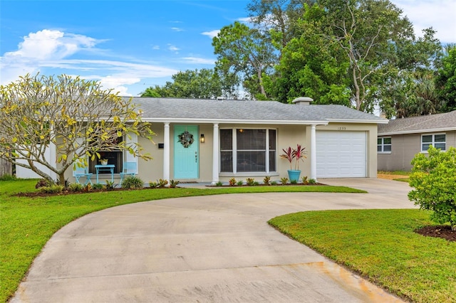 ranch-style home with a garage and a front yard