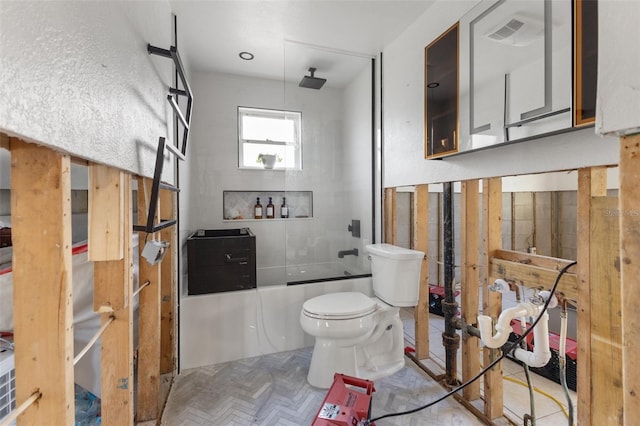 bathroom featuring  shower combination, parquet flooring, and toilet