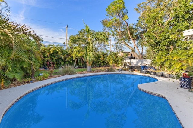 view of swimming pool featuring a patio area