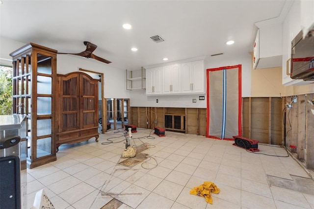 miscellaneous room featuring light tile patterned floors and ceiling fan