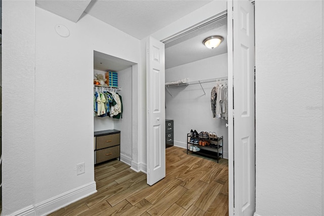 walk in closet featuring light hardwood / wood-style floors