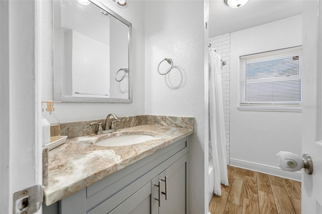 bathroom featuring vanity and hardwood / wood-style floors