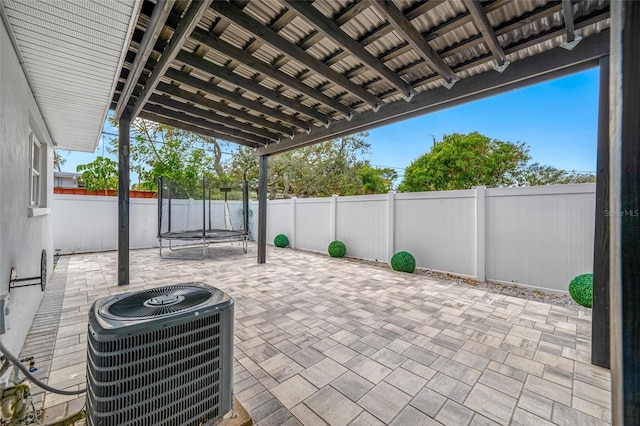 view of patio / terrace featuring a trampoline and central air condition unit