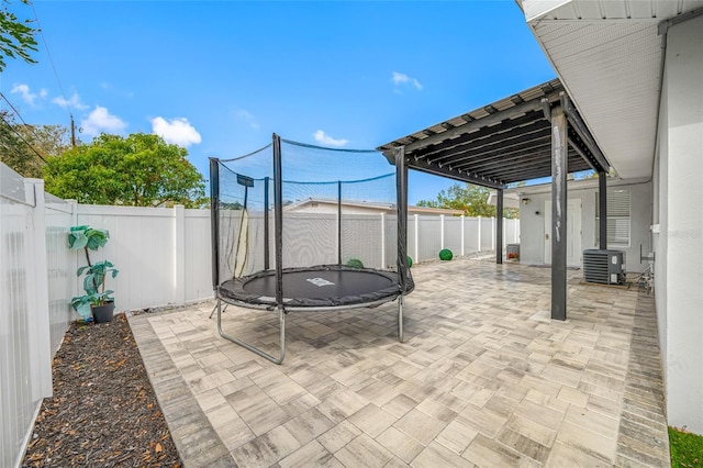 view of patio / terrace featuring cooling unit and a trampoline