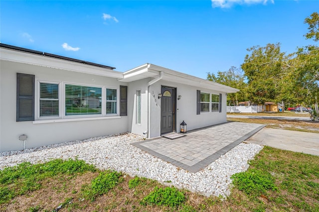 view of front of house with a patio area