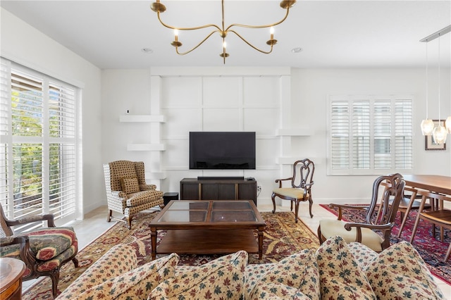 living room with a notable chandelier and tile patterned floors