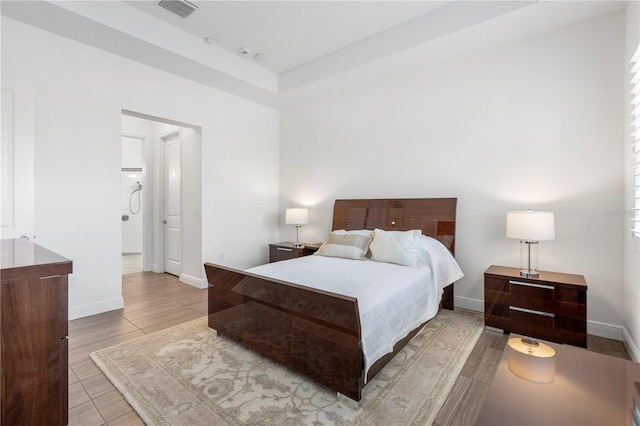 bedroom with light tile patterned floors