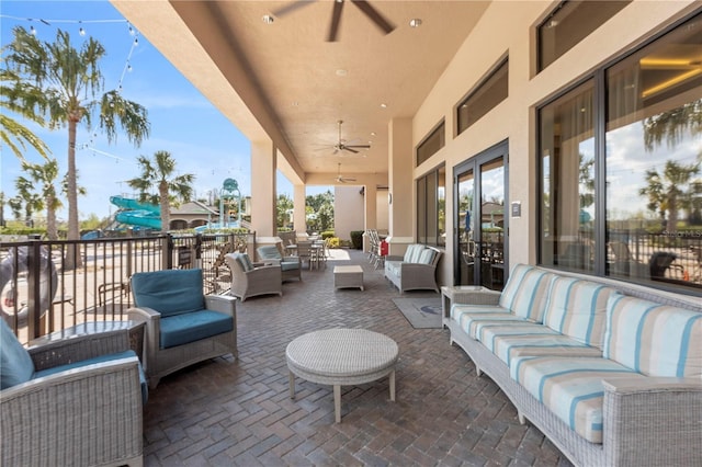 view of patio with ceiling fan and an outdoor hangout area