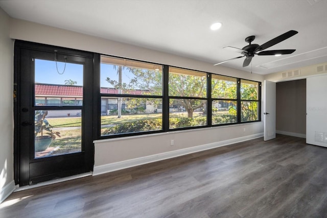 spare room featuring ceiling fan and dark hardwood / wood-style flooring