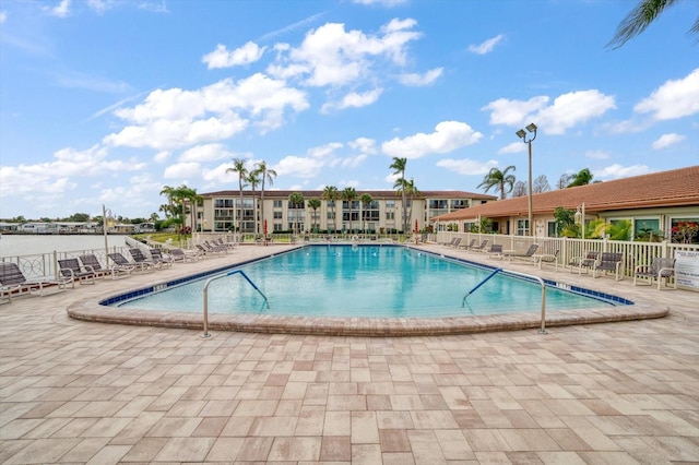 view of swimming pool featuring a patio area