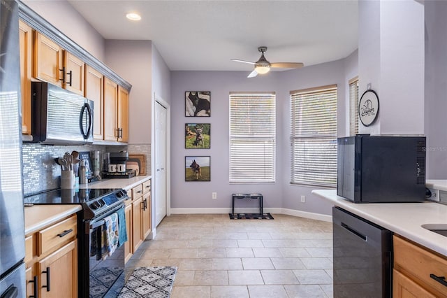 kitchen featuring black appliances, a ceiling fan, light countertops, and decorative backsplash