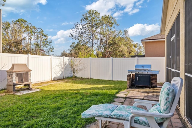 view of yard featuring a patio area and a fenced backyard