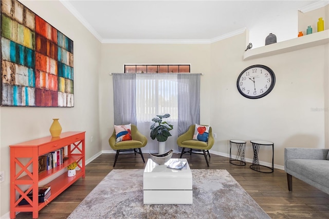 sitting room with crown molding and dark hardwood / wood-style flooring