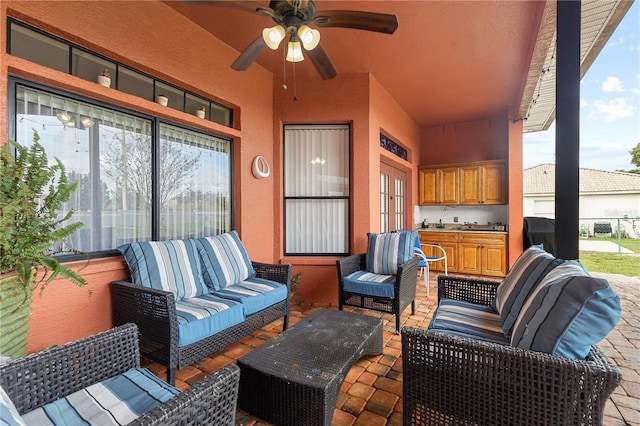 view of patio / terrace with an outdoor hangout area, french doors, and ceiling fan