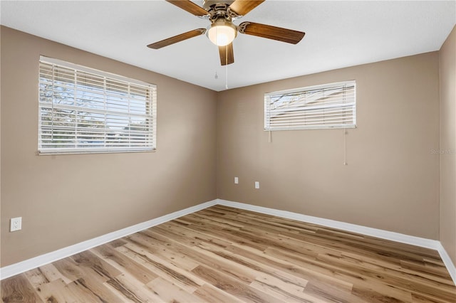 spare room with ceiling fan and light hardwood / wood-style floors