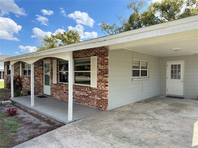 entrance to property with a carport