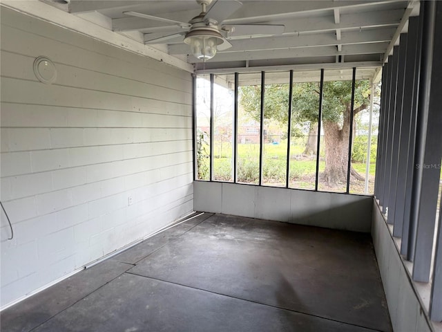 unfurnished sunroom with ceiling fan and a wealth of natural light