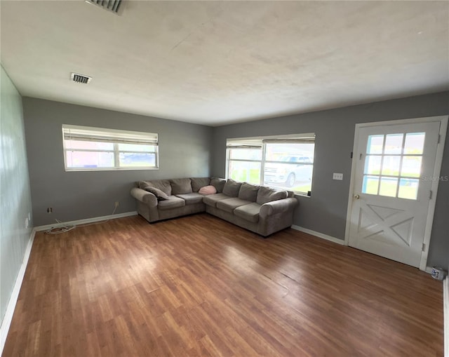 unfurnished living room with hardwood / wood-style floors