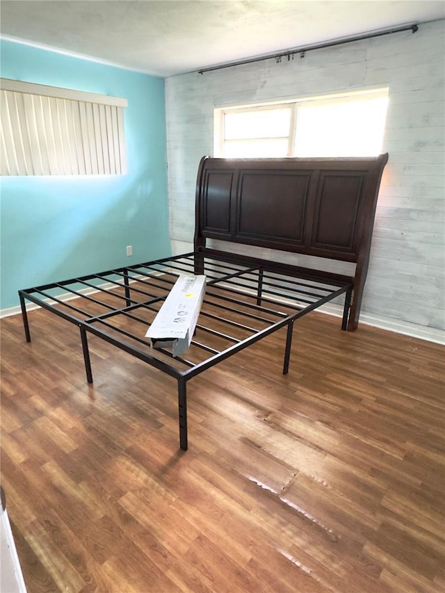 bedroom with wood-type flooring