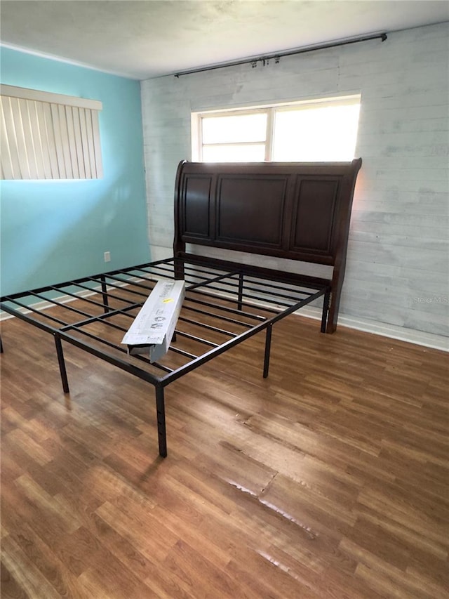 bedroom with hardwood / wood-style floors