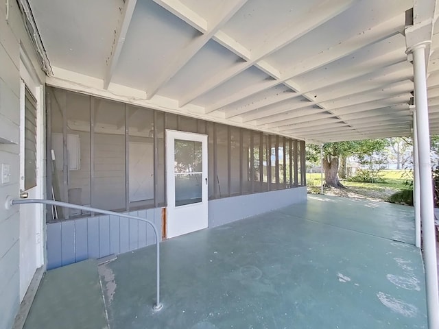 view of patio with a sunroom