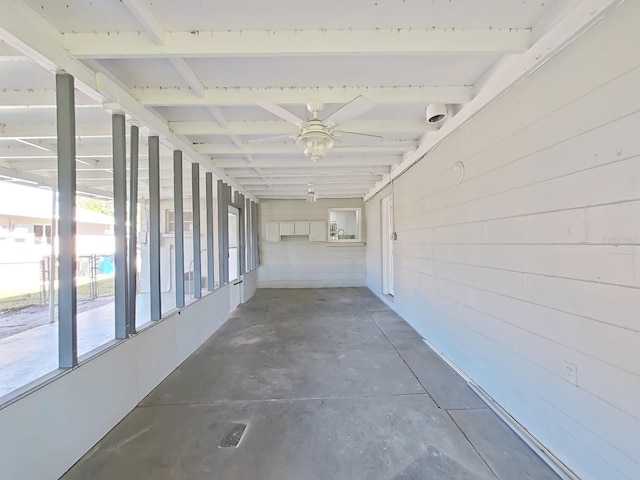 corridor featuring unfinished concrete floors