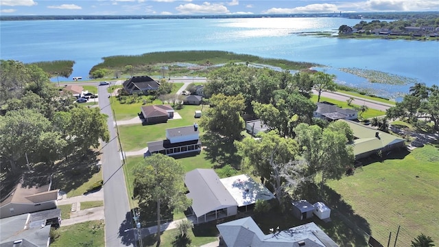 birds eye view of property with a residential view and a water view